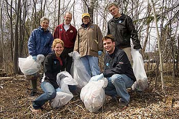 Students, faculty and staff cleaning campus areas.