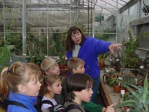 Deb Shubat with kids on a tour