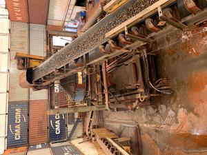 A piece of large equipment in a warehouse.